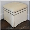 F12. One of a pair of upholstered ottomans with nailhead trim. 